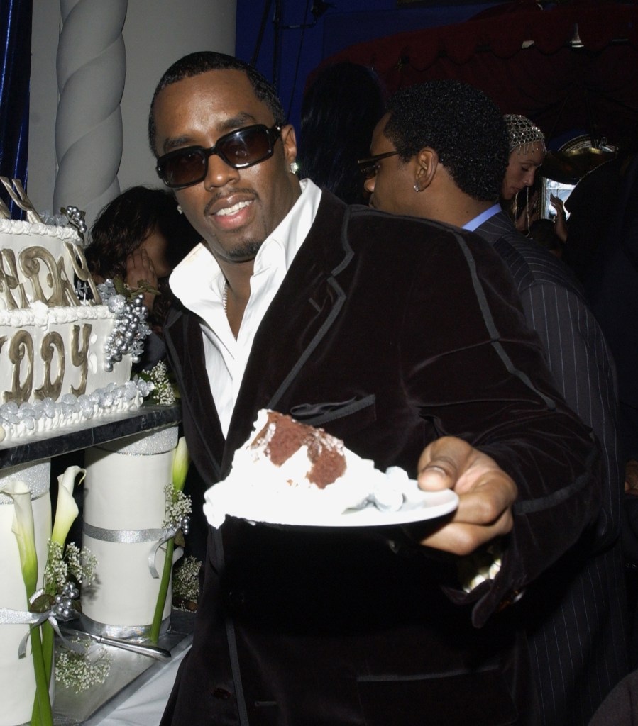 Sean "Diddy" Combs eating cake. 